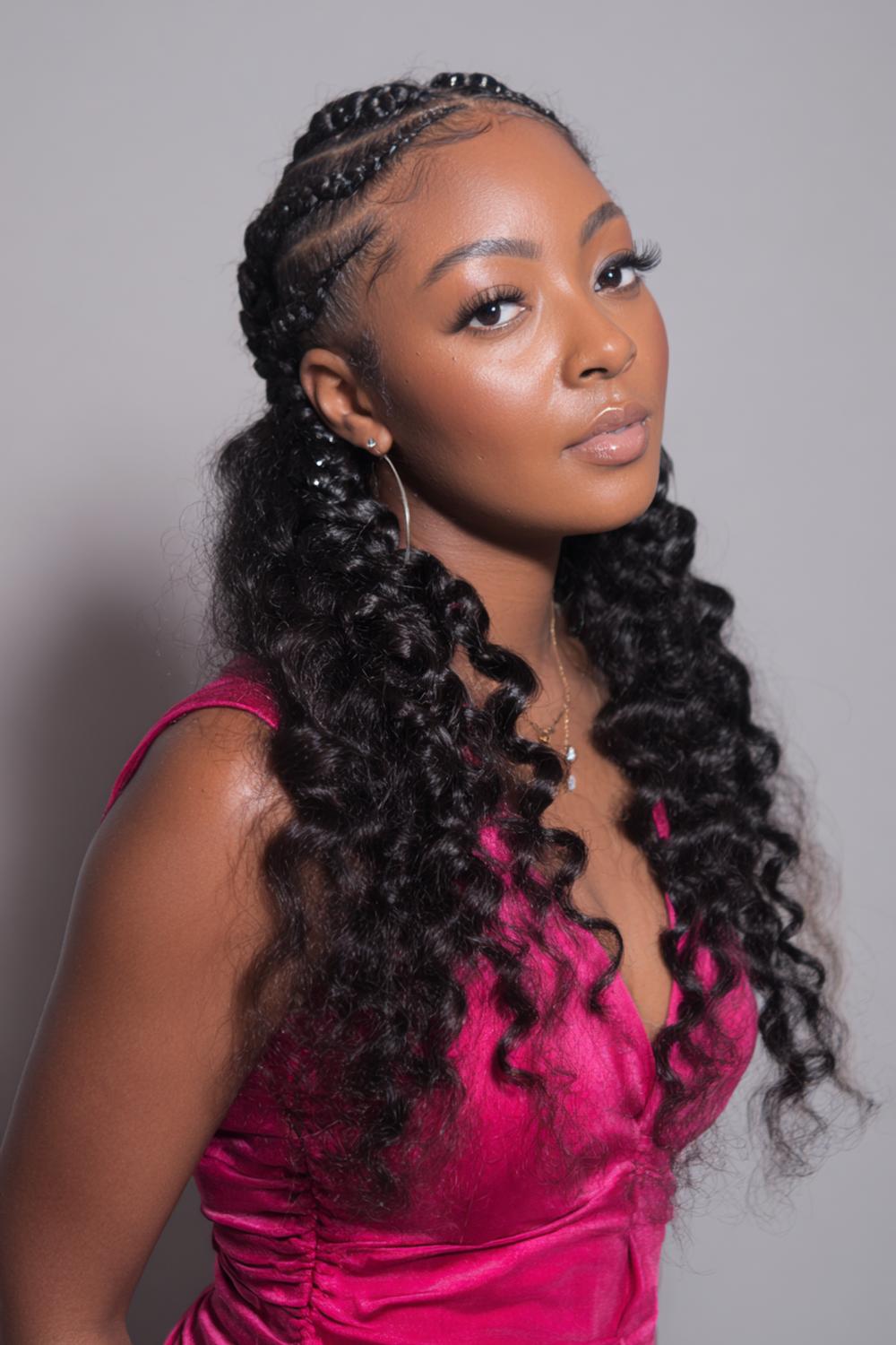 9. Goddess Braided Cornrow Hairstyles with Wavy Accent Pieces