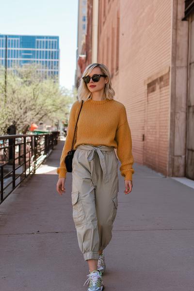 3. Brandy Sweater Outfit with Relaxed Cargo Pants and Retro Sneakers