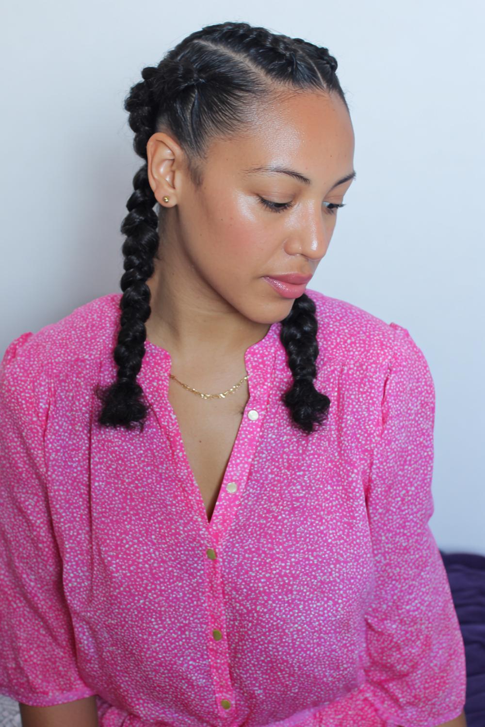 4. Cute braided hairstyles: Two boxer braids with glossy middle part