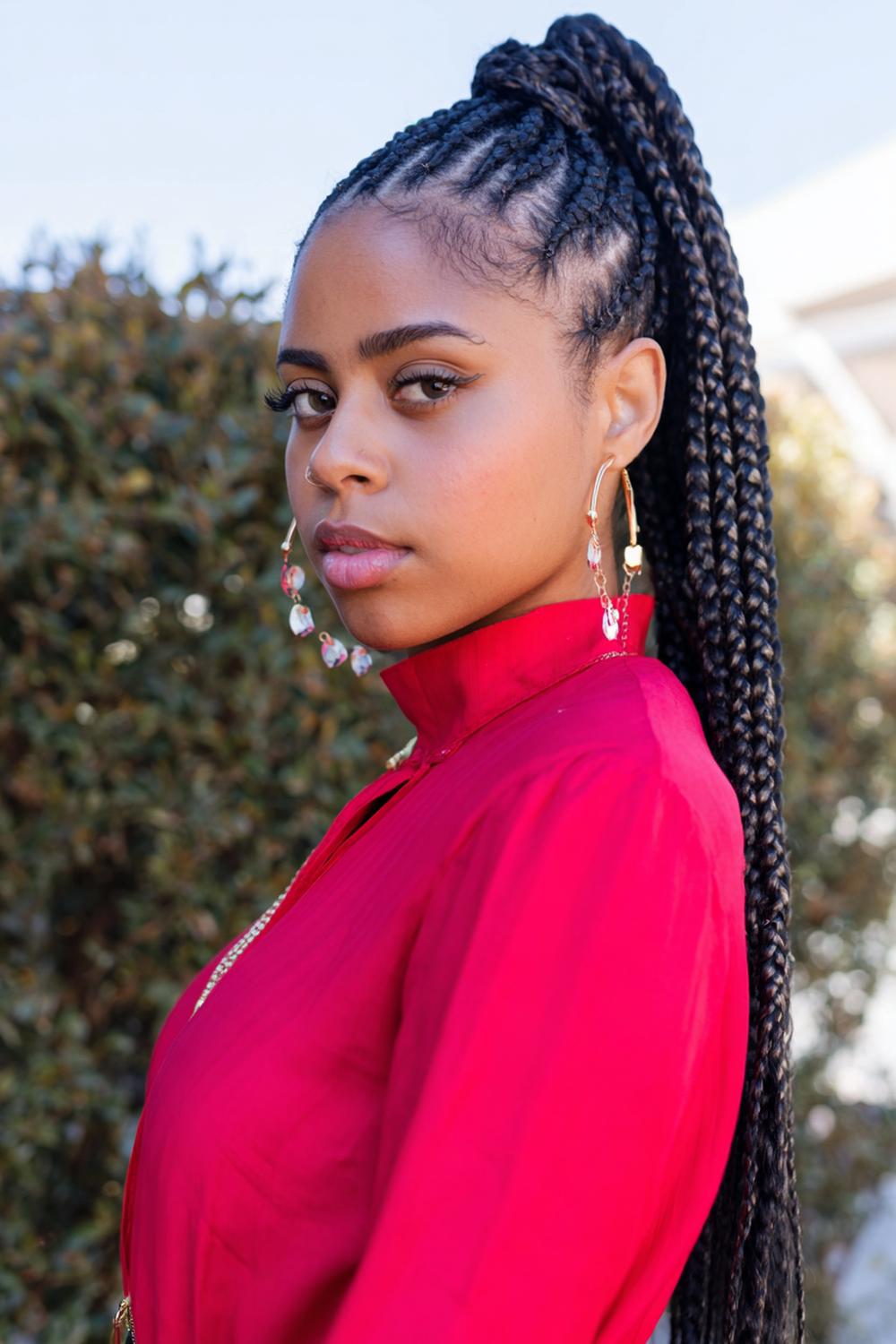 2. Knotless Braids Hairstyles in a Sleek Low Braided Ponytail