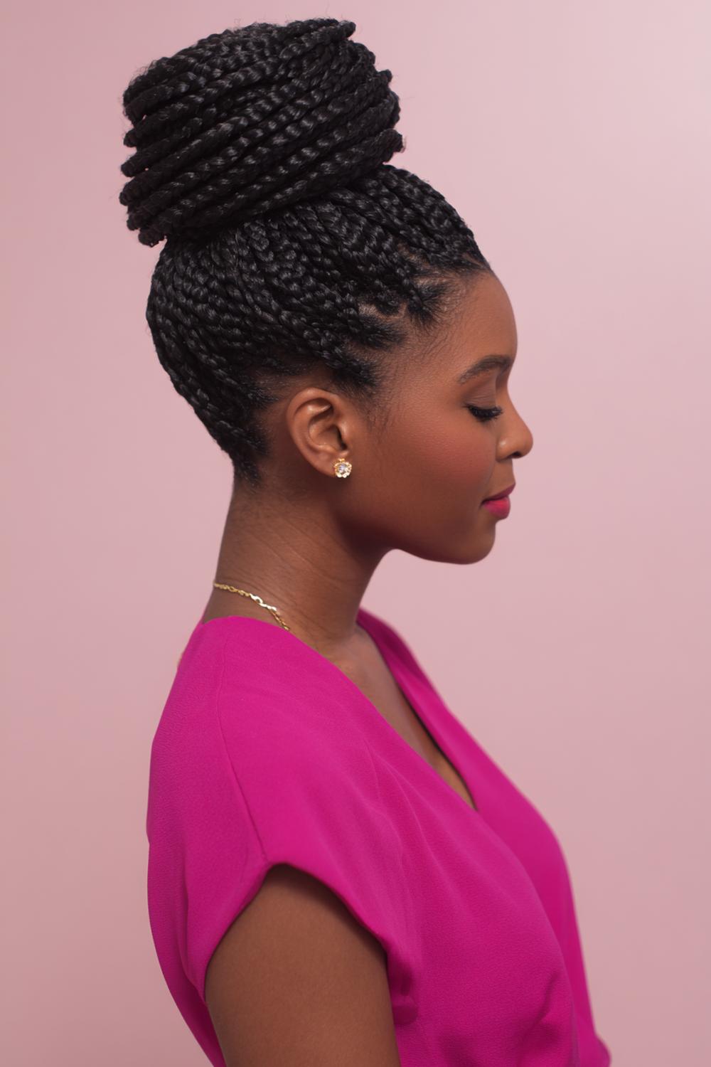 24. Knotless Braids Hairstyles with Spiral Bun and Sleek Edge Detail