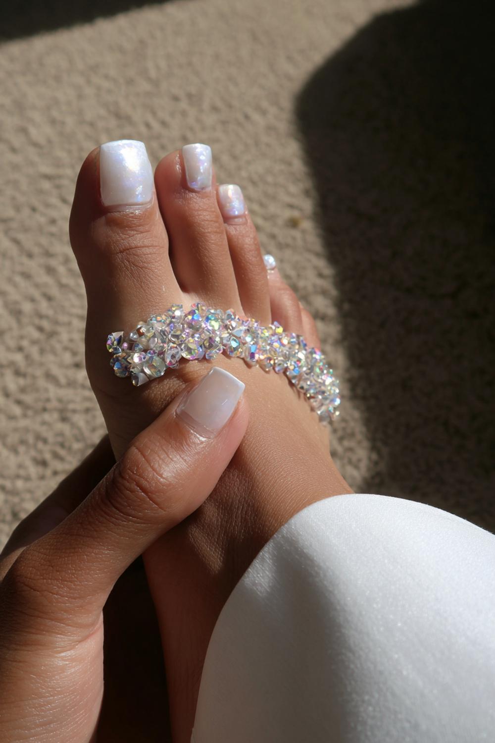 7. White Toes With Bling on Big Toe and Minimal Nude Hands