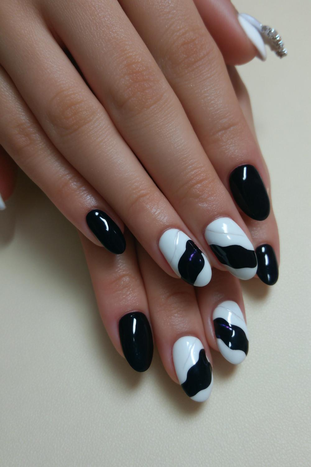 25. Black and White Nails with Layered Waves and Curved Contrast