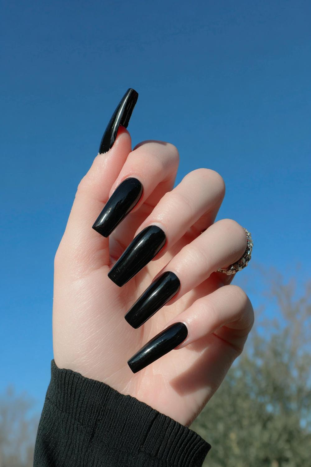 29. Black Acrylic Nails Extra-Long Coffin with Tapered Black Tips
