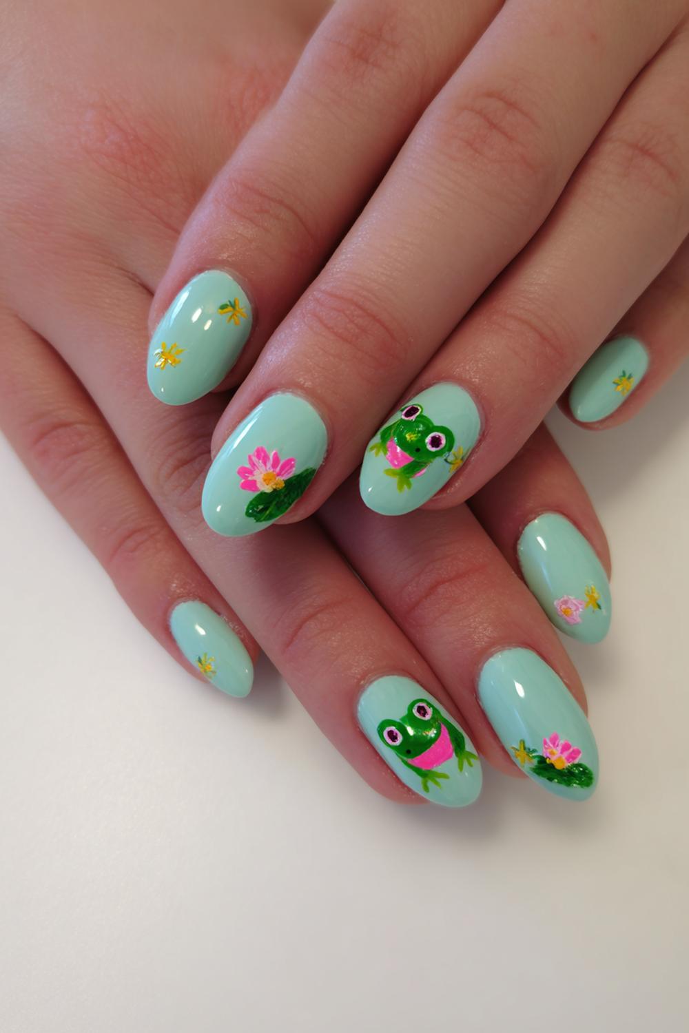 17. Nails for kids with mint base and tiny frog faces