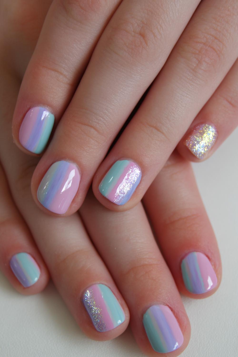23. Nails for kids with pastel unicorn mane streaks and shimmer