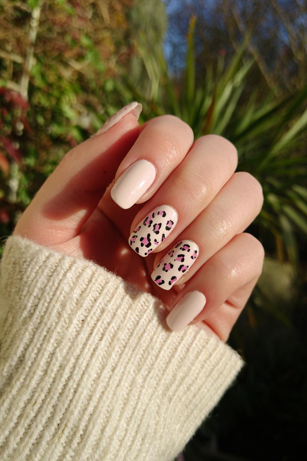 25. Nails for kids with animal print: pastel leopard spots and nude base