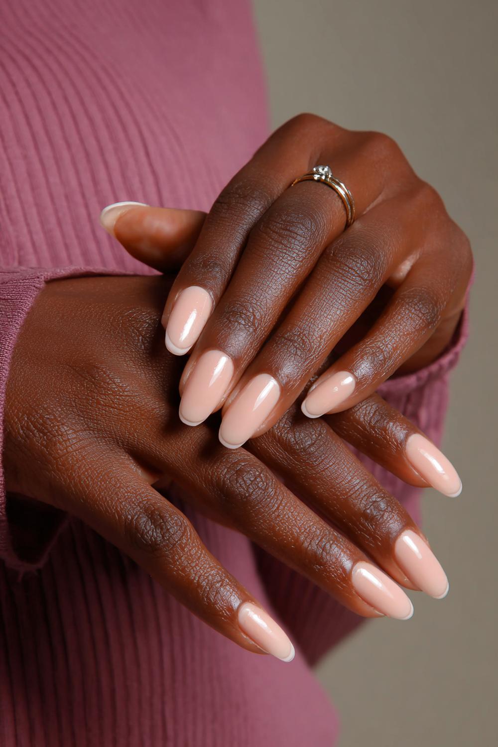 1. Cocoa Nude Micro-French Nails on Dark Skin Hands