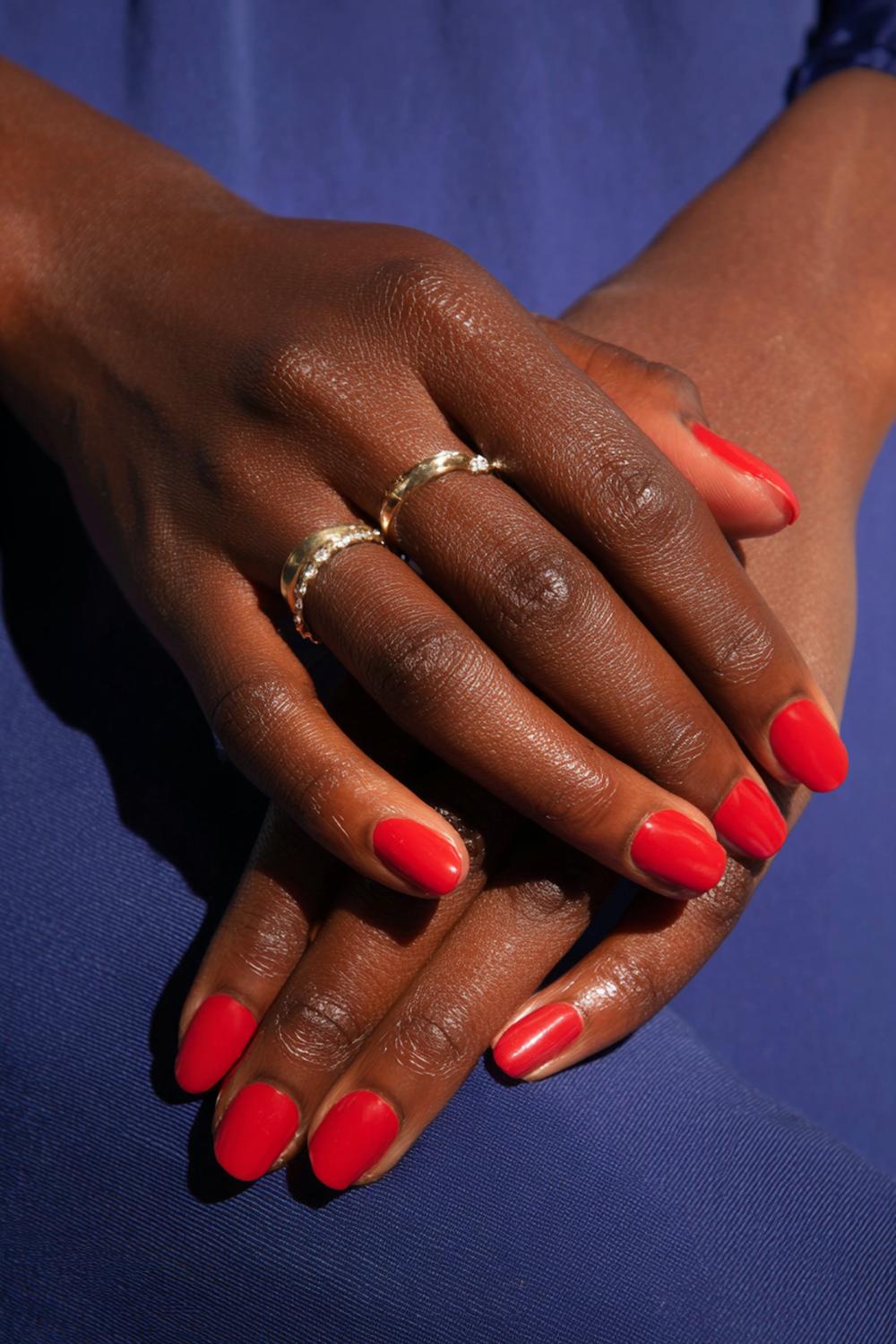 20. Classic Red Nails on Dark Skin Hands with Blue-Red Undertone