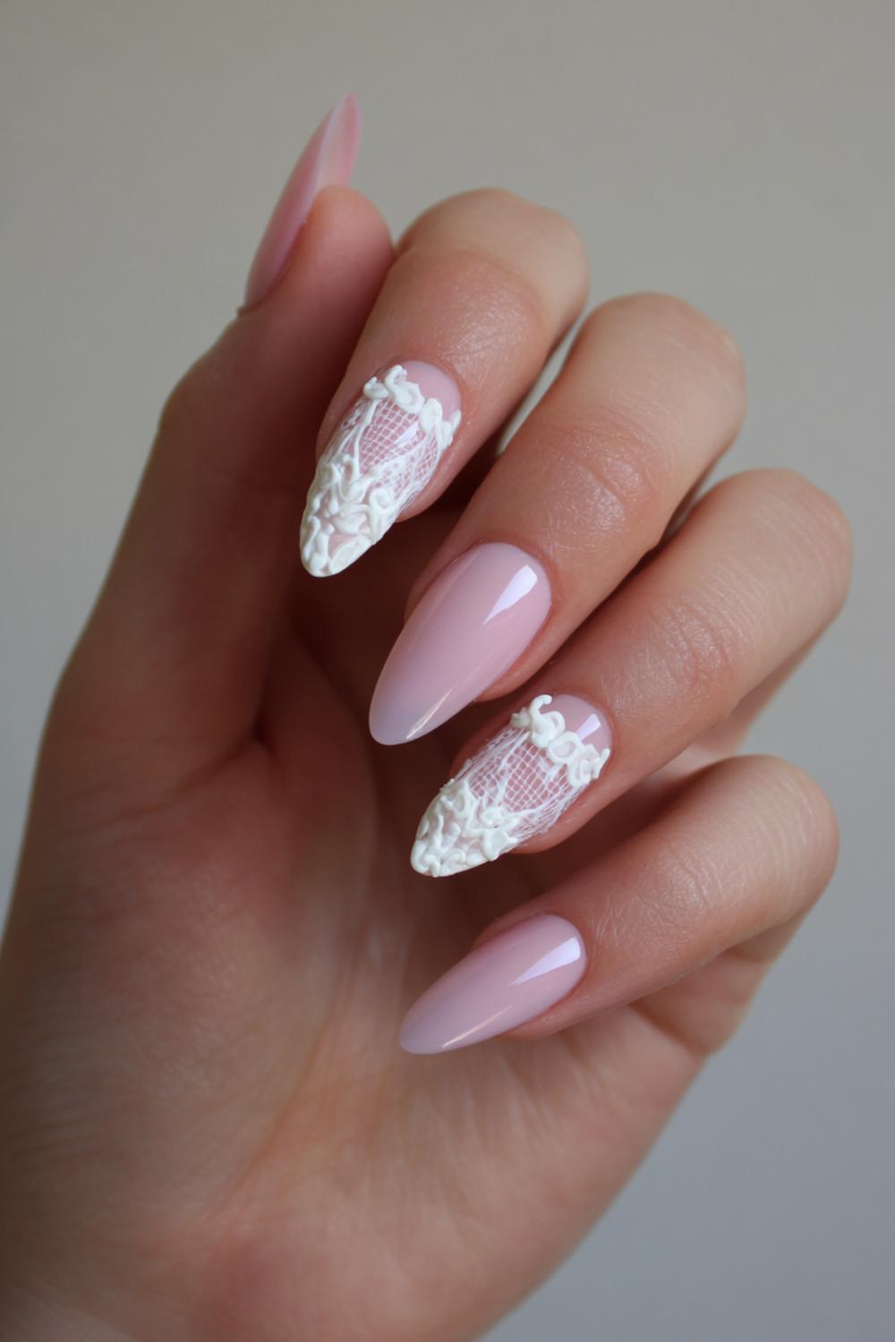 8. Almond 3d Nails with White Lace Relief and Soft Pink Tint