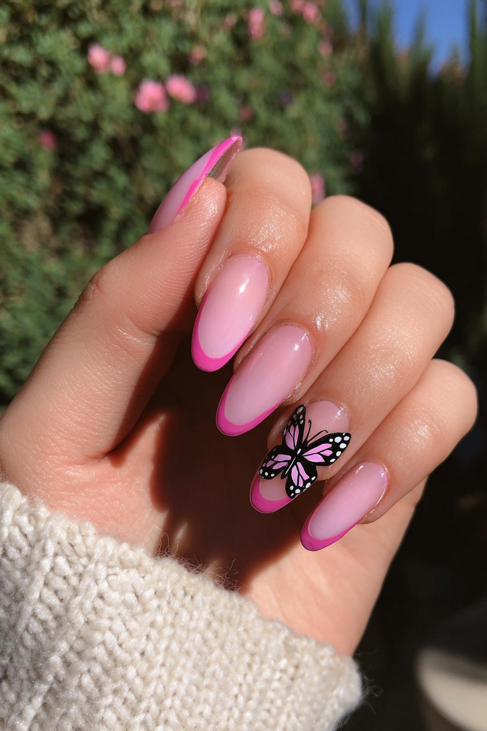 29. Pink French Tip Nails Almond With Design and Butterfly Accent