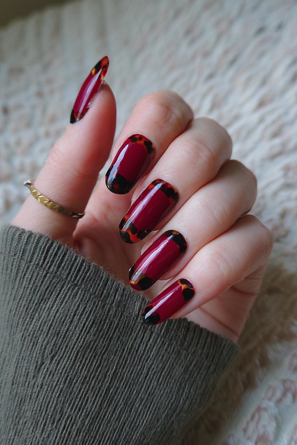 21. Dark Red Nails with Black Tortoiseshell Corners