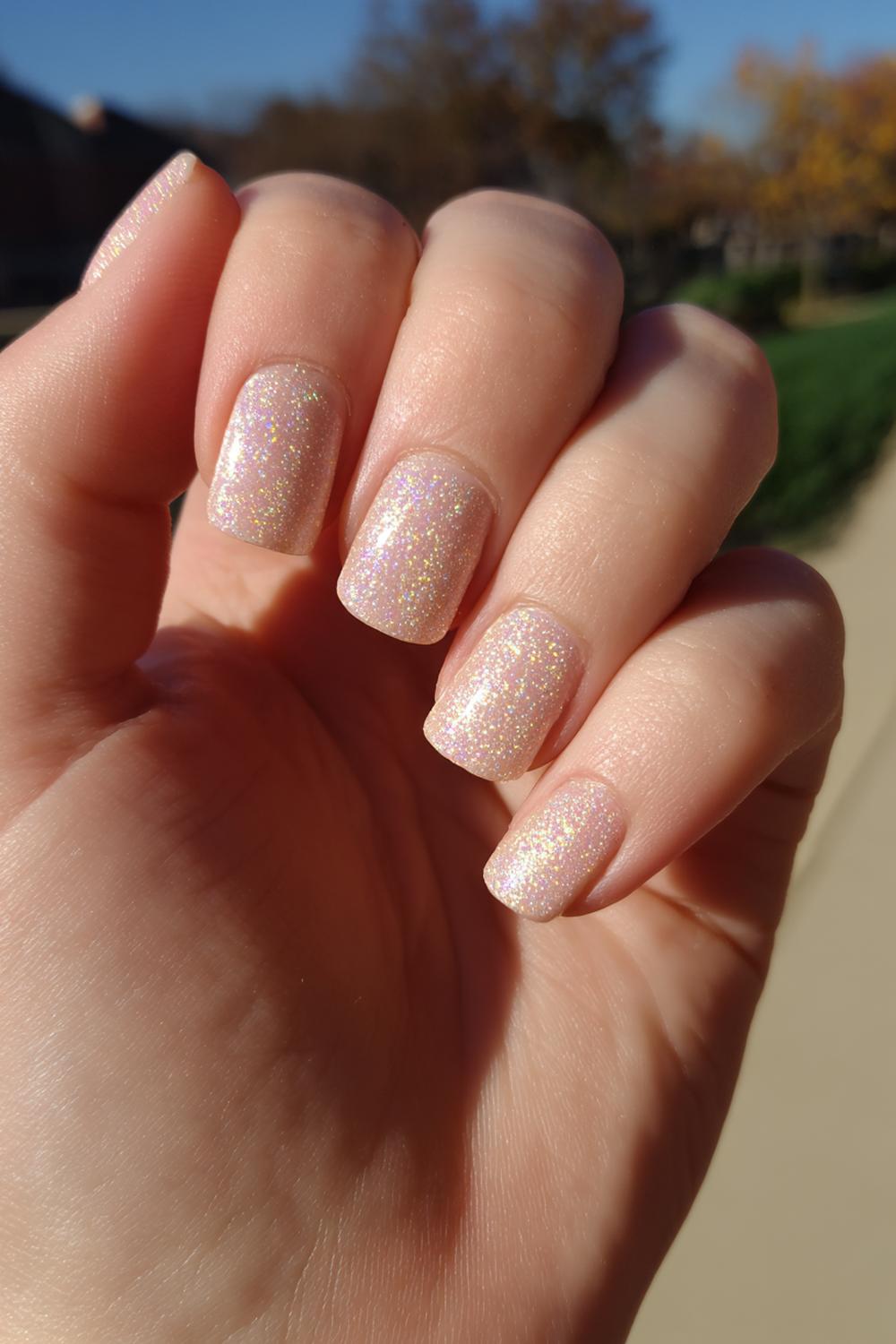 21. Champagne Shimmer Short Nails with Fine Sparkle