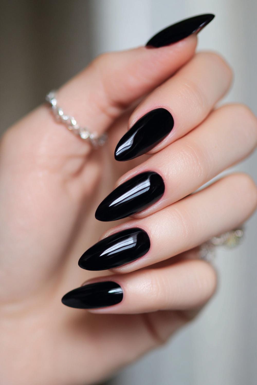 1. Black Dress Nail Ideas: Glossy Jet-Black Almond with High Shine