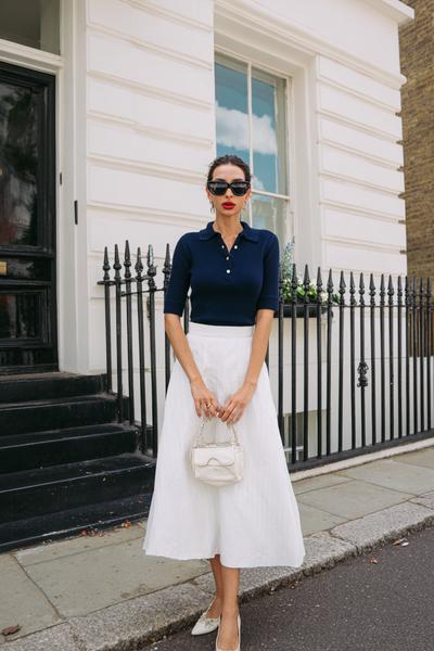 10. Old money outfits 2026 that look Looks Chic with a navy knit polo and white midi skirt