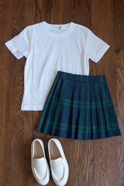 1. School outfit 2026: Crisp white tee and pleated mini with loafers