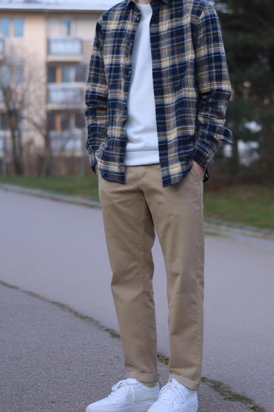 25. School outfit 2026: Flannel overshirt and slim tee with relaxed chinos