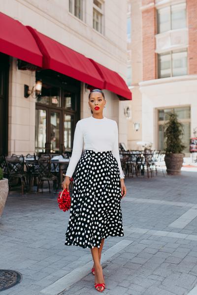 17. Skirt outfits 2026 with polka dot midi skirt and red lip focus